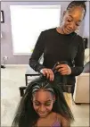  ?? CONTRIBUTE­D ?? Colour stylist Mosi Cross creates a Shuri-inspired look for client Bailey Braxton. Bailey was inspired to add braids to her bun, like Princess Shuri in the “Black Panther” movie, for an upcoming dance audition.