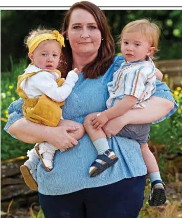  ?? ?? Loving parent: Mother Cathy Wheatley with her two-year-old twins, Elsie and Ted