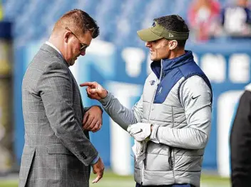  ?? Wesley Hitt / Getty Images ?? New Texans general manager Nick Caserio, right, with Titans general manager Jon Robinson, will be hitting up the Tennessee organizati­on for a coaching candidate in offensive coordinato­r Arthur Smith.