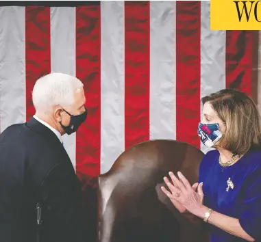  ?? ERIN SCHAFF-POOL/GETTY IMAGES ?? U.S. Vice President Mike Pence and House Speaker Nancy Pelosi were both hustled to safety
by security personnel on Wednesday as a pro-trump mob stormed the U.S. Capitol.