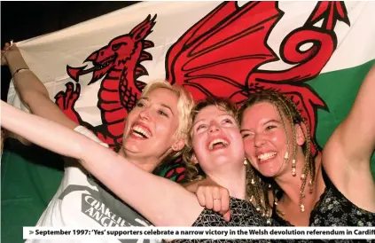  ??  ?? September 1997: ‘Yes’ supporters celebrate a narrow victory in the Welsh devolution referendum in Cardiff