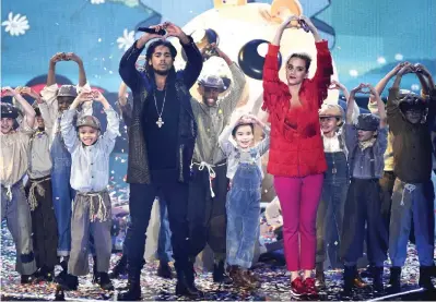  ??  ?? Skip Marley, left, and Katy Perry perform “Chained to the Rhythm”.