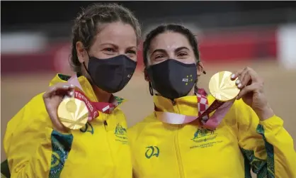  ?? Photograph: Shuji Kajiyama/AP ?? Australia’s Emily Petricola and Paige Greco hold their cycling gold medals at the Tokyo 2020 Paralympic Games. The government has moved to give medal-winning Paralympia­ns the same bonus as Olympians.