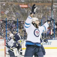  ??  ?? Winnipeg’s Chris Thorburn reacts after scoring during the second period against the Blues on Tuesday in St. Louis. His tally stood up as the winner in a crucial 1- 0 win for the Jets.