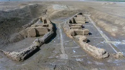  ?? The Associated Press ?? ■ What is considered a world’s oldest bridge, some 4,000 years old, is seen Feb. 23 by the ancient city-state of Lagash, near Nasiriyah, Iraq.