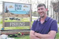  ?? Daniel Brown/Local Journalism Initiative Reporter ?? Josh Lindsay stands in front of his businesses sign at Ben's Lake Campground in Belfast.