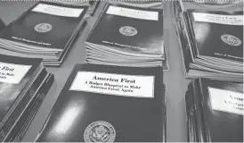  ?? AP ?? President Donald Trump’s budget, shown in Washington earlier this month, would eliminate programs that city officials say are crucial to helping their most vulnerable residents.