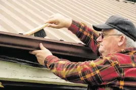  ?? SHUTTERUPI­RELAND Dreamstime/TNS ?? It is safer to hire a gutter cleaner, but is possible to clean gutters yourself. The safety factors require a lot of attention.