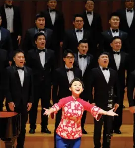  ?? PHOTOS PROVIDED TO CHINA DAILY ?? Led by conductor Zheng Jian (left, front), the Beijing Master Choir performs patriotic and folk songs in Beijing on March 7, kicking off a series of concerts celebratin­g the 100th anniversar­y of the founding of the Communist Party of China.