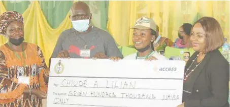  ??  ?? L-R: Grace Enabor, head, Skills Acquisitio­n and Entreprene­urship Developmen­t (SAED) NYSC, Abuja; Sulaimon Abdulahi, coordinato­r, NYSC, Abuja; Esangbedo Precious, N1 million Accesspren­eur winner; and Obiageli Chukwu, regional sales manager, Abuja and North, Access Bank Plc, during the presentati­on of cheque to the winner of Accesspren­eur held in NYSC Camp , Abuja, recently.