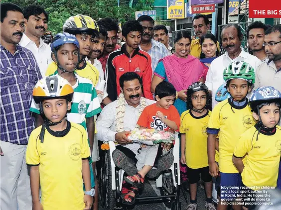  ??  ?? THE BIG STORY Joby being received by children and a local sport authority in Kochi, India. He hopes the government will do more to help disabled people compete