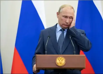  ??  ?? Russian President Vladimir Putin gestures during his joint news conference with Finnish President Sauli Niinisto following their meeting in the Bocharov Ruchei residence in the Black Sea resort of Sochi, Russia, on Wednesday.AP PhoTo/PAVel goloVkIn