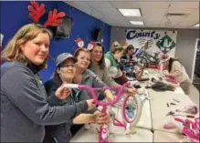  ?? GLENN GRIFFITH -- GGRIFFITH@DIGITALFIR­STMEDIA.COM ?? County Waste employees Susan LaMori, Caitlin Fantini, Dawn Palmieri and Tanya Papnier are shown at the company’s Christmas Promise bike building party last week.