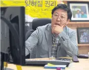  ??  ?? Kim Ho-jin, CEO of Santa Cruise ‘digital laundry’ company, checking a computer screen for ‘revenge porn’ at his office in Seoul. The company is tasked with taking down videos posted without consent.
