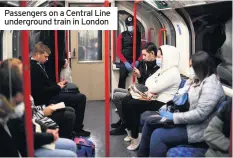  ??  ?? Passengers on a Central Line undergroun­d train in London