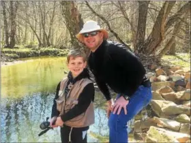  ?? TOM TATUM — FOR DIGITAL FIRST MEDIA ?? Abraham Utecht enjoyed Mentored Youth Trout Day on West Valley Creek last year under the watchful, mentoring eye of his father Alex.