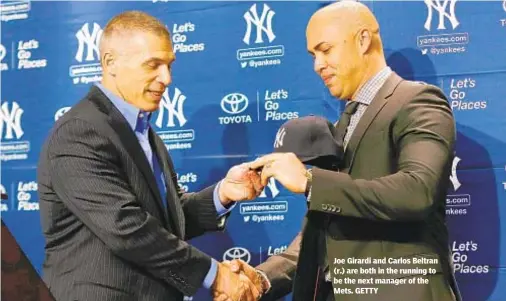  ??  ?? Joe Girardi and Carlos Beltran (r.) are both in the running to be the next manager of the Mets. GETTY