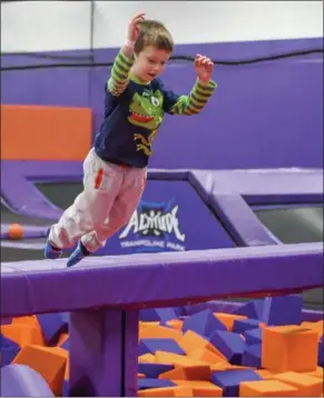  ?? ERIC BONZAR — THE MORNING JOURNAL ?? Four-year-old Jace Hune leaps into a foam block pit Nov. 29, at Altitude Trampoline Park in Elyria.