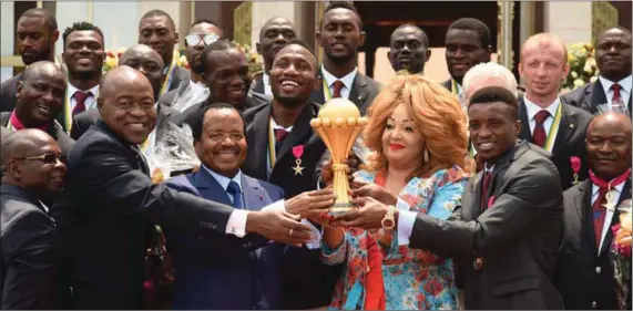  ??  ?? President Paul Biya and his wife Chantal (middle), with the Indomitabl­e Lions and their officials at a Presidenti­al Reception in Yaounde, Cameroon… yesterday