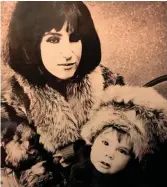  ??  ?? Mini in mink: with her son, 1962