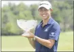  ?? DARRON CUMMINGS - THE ASSOCIATED
PRESS ?? Collin Morikawa holds his trophy after winning the Workday Charity Open golf tournament, Sunday, July 12, 2020, in Dublin, Ohio.