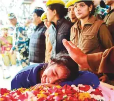  ?? PTI ?? A family member of slain CRPF Mahesh Yadav grieves before his funeral at Tudihar in Allahabad district yesterday.