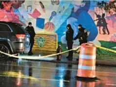 ?? ?? Police secure the scene where a 15-year-old boy was shot and killed near Police Athletic League in the Bronx in January. A second victim was wounded.
