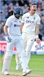  ??  ?? England pacer James Anderson celebrates after dismissing India captain Virat Kohli