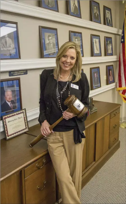  ?? WILLIAM HARVEY/THREE RIVERS EDITION ?? New Jacksonvil­le Chamber of Commerce Chairwoman Sheryl Boyd stands in the board room of the chamber office in Jacksonvil­le. Boyd, who graduated from Jacksonvil­le High School in 1981, said she knows so many of the former chairmen who are pictured in the...