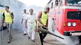  ??  ?? Fumigating the main bus stand in Colombo Pettah