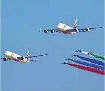  ?? Courtesy: Emirates ?? Emirates Boeing 777 and Airbus A380 join Al Fursan in a spectacula­r fly past to open Dubai Airshow flying display yesterday.