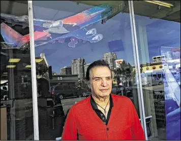  ?? MEL MELCON / LOS ANGELES TIMES ?? Farhad Besharati, owner of a travel agency, attributes a decline in his business to the arrests of dual nationals in Iran. “My business is down 50 percent,” said Besharati. “(My customers) are asking what would happen to them if they go back to Iran. I...