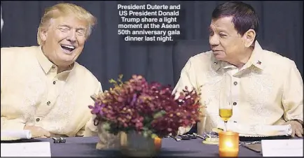  ??  ?? President Duterte and US President Donald Trump share a light moment at the Asean 50th anniversar­y gala dinner last night.