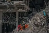  ?? RAMON ESPINOSA — THE ASSOCIATED PRESS ?? Rescuers search for survivors at the site of Friday’s deadly explosion, which destroyed the five-star Hotel Saratoga, in Havana, Cuba, Saturday.