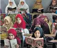  ?? ?? Afghan girls read the Quran in the Noor Mosque outside Kabul, as schools are shut
