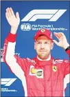  ?? (AP) ?? Ferrari driver Sebastian Vettel of Germany waves to fans after taking pole position for the Chinese Formula One Grand Prix at the Shanghai Internatio­nal Circuit in
Shanghai, on April 14.