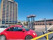  ?? STAFF PHOTO BY MIKE PARE ?? Some of the parking in lots at Broad and Sixth streets in downtown Chattanoog­a is shown Thursday. A company connected to a top official with hotel developer Dynamic Group purchased the site, though he’s not sure it will hold lodging.