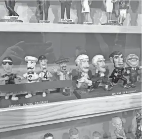  ?? JEFF ZILLGITT/USA TODAY ?? The Brewers’ racing sausages and the Nationals’ racing presidents are on display at the National Bobblehead Hall of Fame and Museum.