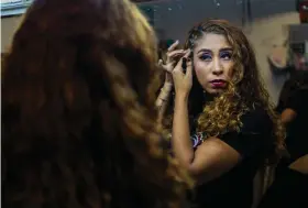  ?? ?? Perla Sanchez gets ready for the semifinals of the first Miss Colonia pageant hosted by the Factoría nightclub in Veracruz, Mexico, Sunday, March 5, 2023. (AP Photo/Felix Marquez)