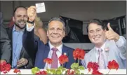  ??  ?? Governor Andrew M. Cuomo, left, with John Hendrickso­n, the husband of late socialite Marylou Whitney, during a visit to Saratoga Race Course on Aug. 3 of last season.
