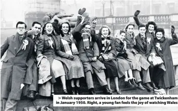  ??  ?? > Welsh supporters arrive in London for the game at Twickenham in January 1950. Right, a young fan feels the joy of watching Wales