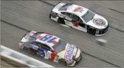  ?? PAUL ABELL - THE ASSOCIATED PRESS ?? Kyle Busch (18) and Kevin Harvick (4) race down the front stretch during the NASCAR Cup Series race last Sunday at Atlanta Motor Speedway.