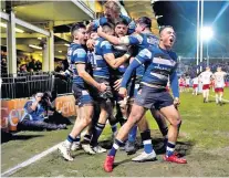  ?? ?? Revival: Will Muir goes over for the first of his two tries for Bath (above) and (left) is congratula­ted by his team-mates