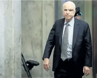  ?? WIN MCNAMEE/GETTY IMAGES ?? Sen. John McCain returns to the U.S. Senate on Tuesday, in Washington, D.C. McCain was recently diagnosed with brain cancer but returned on the day the Senate is holding a key procedural vote on U.S. President Donald Trump’s effort to repeal and...