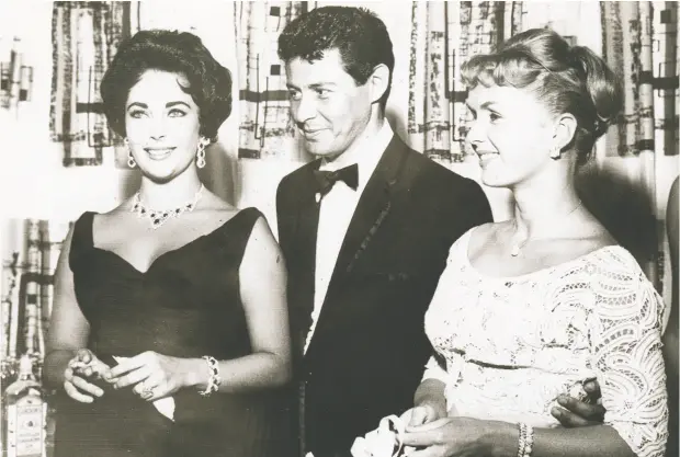  ?? THE ASSOCIATED PRESS FILES ?? Elizabeth Taylor, left, seen in 1958 with Eddie Fisher and his wife Debbie Reynolds, never pretended to be ordinary.