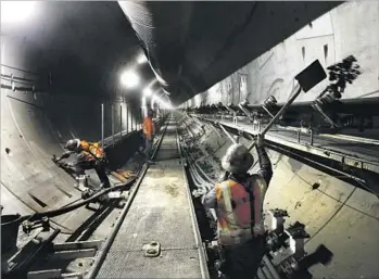  ?? Mel Melcon Los Angeles Times ?? SIXTY FEET below, the muck — a combinatio­n of earth, chemicals and water — is whisked along a conveyor belt. With its cranes, loaders and excavators, the undergroun­d world is a big kid’s dream.