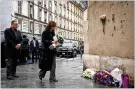 ?? NEW YORK TIMES ?? U.S. Vice President Kamala Harris and her husband lay flowers at a memorial to Paris terror victims.