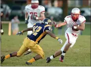  ?? NEWS-HERALD FILE ?? Conner Krizancic of the Mentor football team tries to elude Euclid’s Ryan Epps during a 2012game. Krizancic has been named the No. 2 player of the decade for Mentor by MaxPreps, trailing only former teammate Mitchell Trubisky.