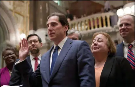  ?? MIKE GROLL — THE ASSOCIATED PRESS ?? With Senate colleagues looking on, Sen. Todd Kaminsky, D-Long Beach, is sworn-in in the Senate Chamber at the state Capitol on Tuesday, May 3, 2016, in Albany, N.Y. Kaminsky replaces former Senate Majority Leader Dean Skelos, who was convicted on...