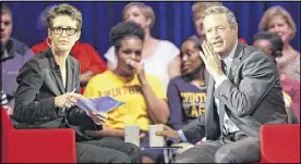  ?? CHUCK BURTON / AP ?? Democratic presidenti­al candidate former Maryland Gov. Martin O’Malley (right) gestures as MSNBC’s Rachel Maddow looks on during a Democratic presidenti­al candidate forum.